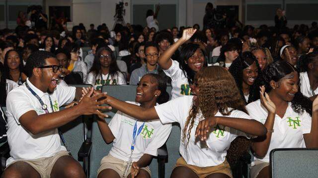 Senior class council from left to right: Jaden Turner, president, Amaya Henry, vice president, Jayli Exceus-Asante, secretary, and Jayla Huntley-Murphy, treasurer, react to hearing that prom tickets will be free for students during a ceremony with the senior class announcing that Becca’s Closet and Macy’s donated $65,000 so that prom would be free for students on Thursday, March 26, 2026, at Nova High School in Davie, Fla.  “I’ve been president since sophomore year, and…it made me feel relieved I had this weight lifted off my shoulders. I’m just grateful that everyone will get to experience something as big as prom,” said Turner. “The money from our balance is split between the remaining classes so it will continue to help in years to come.”